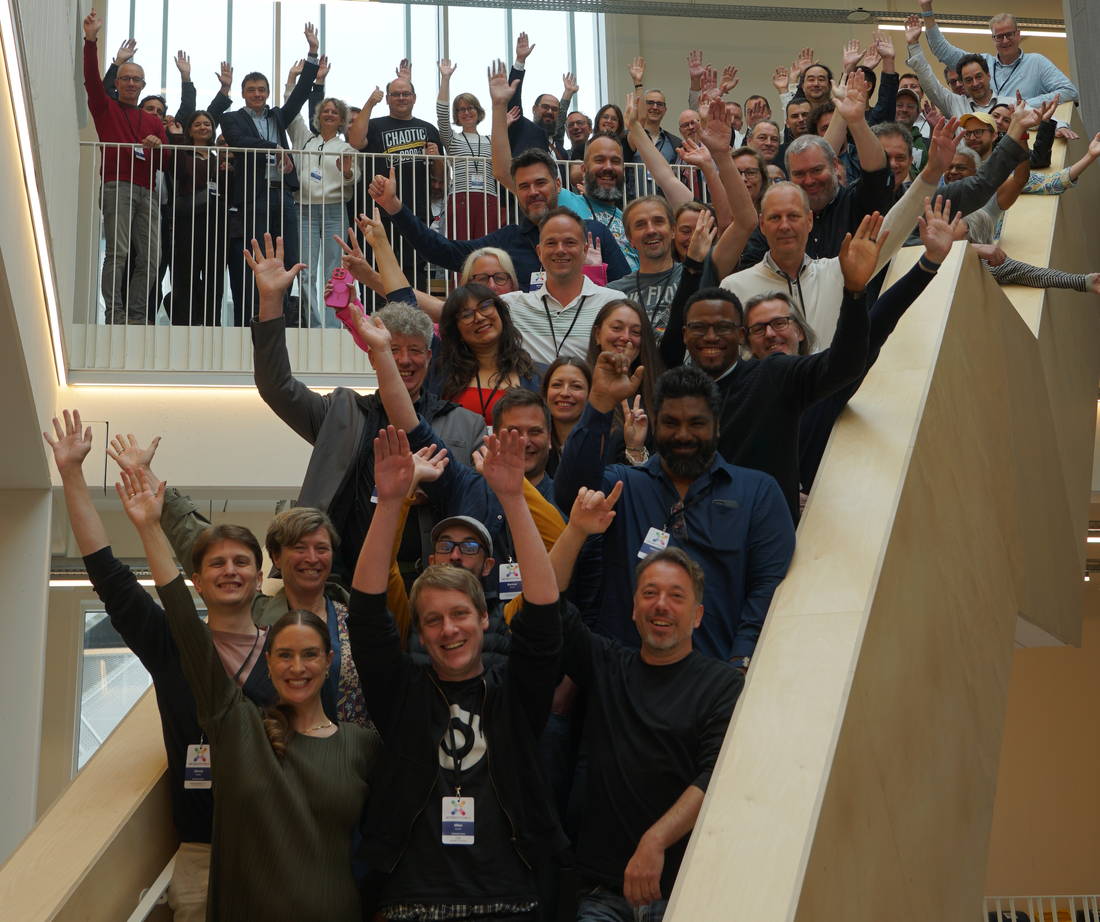 Attendees gathered on a staircase at the close of the Brussels edition.