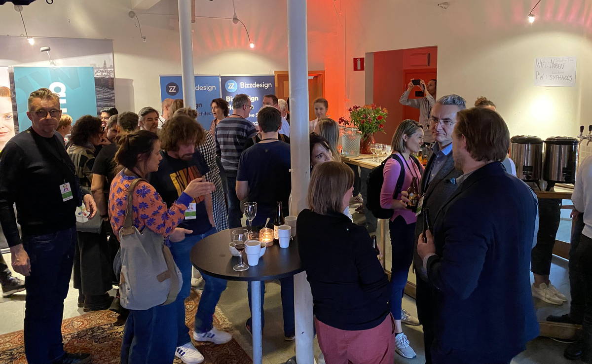 Attendees talking over drinks at the Intersection 2022 cocktail in Stockholm.