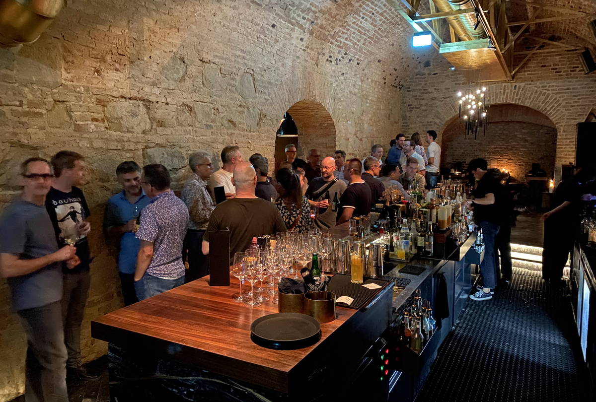 Attendees with drinks at the welcome cocktail, Intersection 2023 in Vienna.